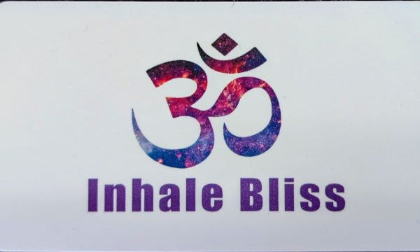 Om symbol with 'Inhale Bliss' text on a white background