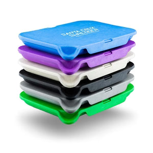 Stack of colorful hemp rolling trays with visible brand name on a white background